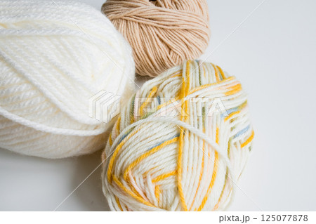 Colorful yarn collection on white background 125077878