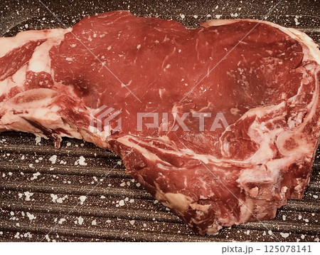 Raw Rob meat on the grill 125078141