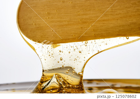 Photo of a sugar paste for depilation hair removal procedure. Texture. 125078602