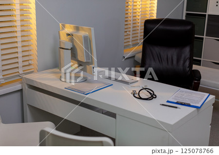 A Modern Office Workspace Featuring a Desk and Chair for Enhanced Productivity and Comfort A Modern Office Workspace Featuring a Desk and Chair for Enhanced Productivity and Comfort 125078766