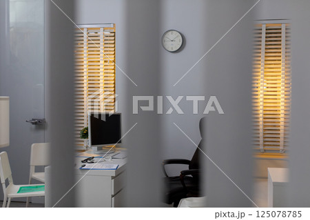 A modern office space designed with advanced technology and ample natural light features 125078785