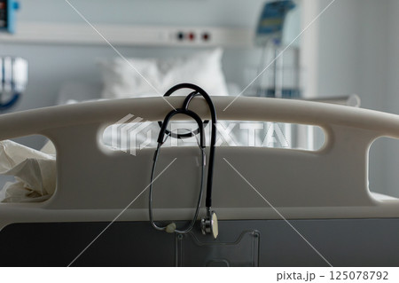 A Stethoscope and Hospital Bed in a Medical Environment for Patient Care and Monitoring 125078792
