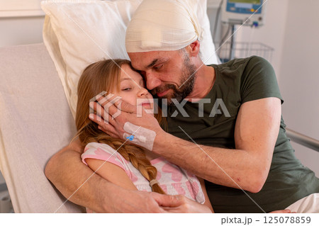 A Touching and Tender Moment Shared Between a Loving Father and Daughter While in Hospital A Touching and Tender Moment Shared Between a Loving Father and Daughter While in Hospital 125078859