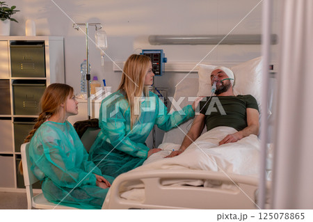 Healthcare scene showing patients and dedicated medical staff in a hospital setting 125078865