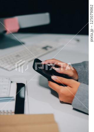 Portrait of Asian young female working on laptop at office 125079862
