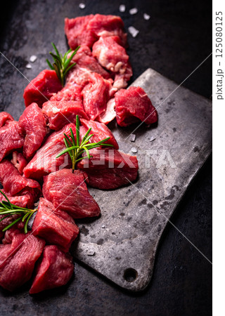 Raw beef meat and ingredients for cooking Raw beef meat and ingredients for cooking 125080125