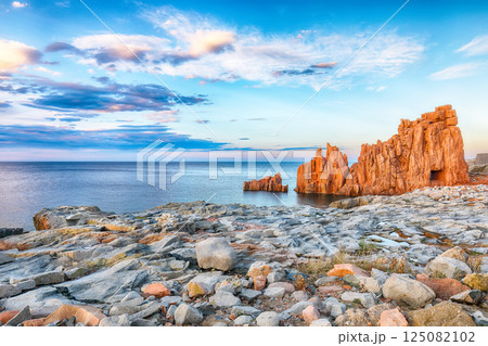 Impressive sunset view of Red Rocks (Rocce Rosse) in Arbatax. Impressive sunset view of Red Rocks (Rocce Rosse) in Arbatax. 125082102