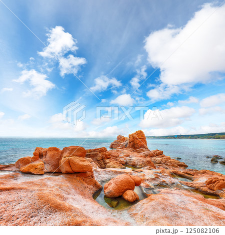 Exciting view of Red Rocks (is Scoglius Arrubius) on Cea beach. Exciting view of Red Rocks (is Scoglius Arrubius) on Cea beach. 125082106