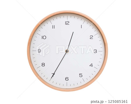 Minimal wall clock with light wood frame and white face displaying 00:35 or 12:35. Perfect for clean, modern concepts about time and scheduling. 125085161