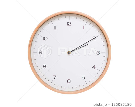 Minimal wall clock with light wood frame and white face displaying 02:10 or 14:10. Perfect for clean, modern concepts about time and scheduling. 125085180