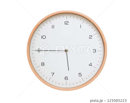 Minimal wall clock with light wood frame and white face displaying 05:45 or 17:45. Perfect for clean, modern concepts about time and scheduling. Minimal wall clock with light wood frame and white face displaying 05:45 or 17:45. Perfect for clean, modern concepts about time and scheduling. 125085223