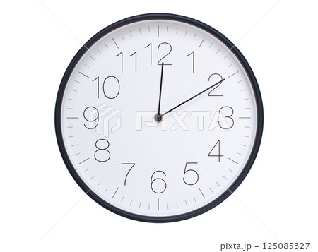 Simple wall clock with black frame and white face displaying 00:10 or 12:10. Ideal for time, schedule, and punctuality themes. Simple wall clock with black frame and white face displaying 00:10 or 12:10. Ideal for time, schedule, and punctuality themes. 125085327