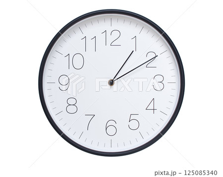 Simple wall clock with black frame and white face displaying 01:10 or 13:10. Ideal for time, schedule, and punctuality themes. 125085340