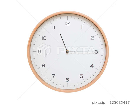 Minimal wall clock with light wood frame and white face displaying 11:15 or 23:15. Perfect for clean, modern concepts about time and scheduling. 125085417