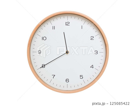 Minimal wall clock with light wood frame and white face displaying 11:40 or 23:40. Perfect for clean, modern concepts about time and scheduling. 125085422