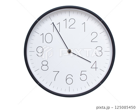 Simple wall clock with black frame and white face displaying 03:55 or 15:55. Ideal for time, schedule, and punctuality themes. 125085450