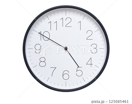 Simple wall clock with black frame and white face displaying 04:50 or 16:50. Ideal for time, schedule, and punctuality themes. 125085461