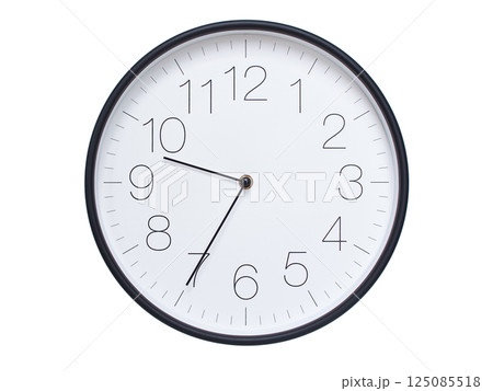 Simple wall clock with black frame and white face displaying 09:35 or 21:35. Ideal for time, schedule, and punctuality themes. 125085518