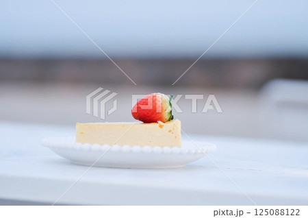 cheesecake with strawberry topping , cheese cake 125088122