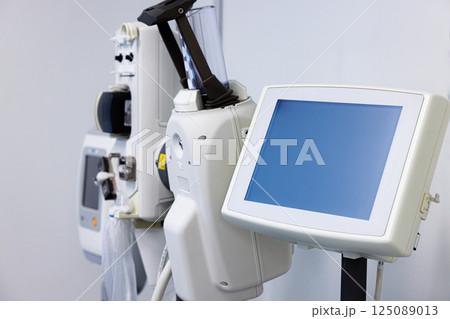 Advanced medical equipment setup in a modern healthcare facility for patient monitoring and treatment Advanced medical equipment setup in a modern healthcare facility for patient monitoring and treatment 125089013