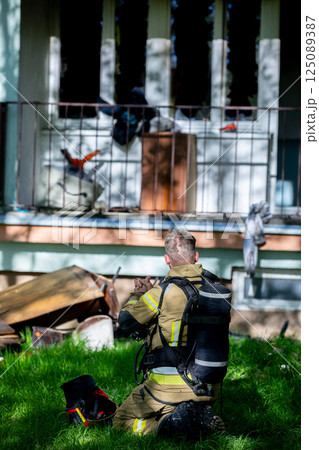 A courageous firefighter is responding to an urgent emergency situation, prepared to help A courageous firefighter is responding to an urgent emergency situation, prepared to help 125089387