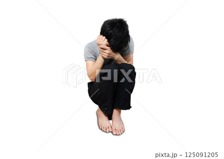 A man sitting in the corner of the room strained unhappy.black and white picture A man sitting in the corner of the room strained unhappy.black and white picture 125091205