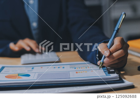 Portrait of Asian young female working on laptop at office Portrait of Asian young female working on laptop at office 125092688