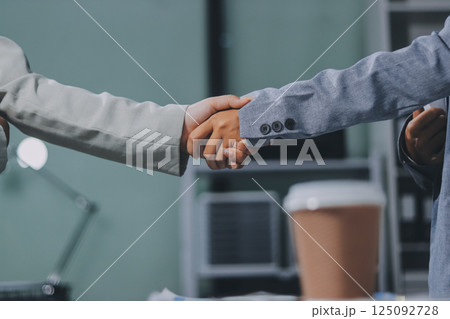 Business handshake for teamwork of business merger and acquisition,successful negotiate,hand shake,two businessman shake hand with partner to celebration partnership and business deal concept Business handshake for teamwork of business merger and acquisition,successful negotiate,hand shake,two businessman shake hand with partner to celebration partnership and business deal concept 125092728