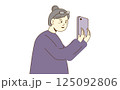 Elderly woman using smartphone with happy expression on white background. Vector illustration. 125092806