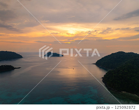 aerial view of beautiful sunset above Ko Pachumba Surin Islands aerial view of beautiful sunset above Ko Pachumba Surin Islands 125092872