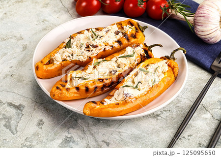 Baked Ramiro pepper stuffed cheese 125095650