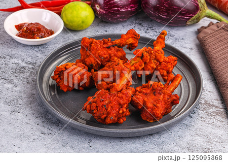 Indian cuisine - spicy Chicken lollipop Indian cuisine - spicy Chicken lollipop 125095868