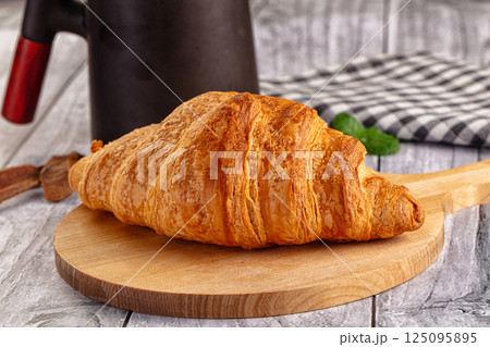 Fresh hot homemade croissant for breakfast Fresh hot homemade croissant for breakfast 125095895