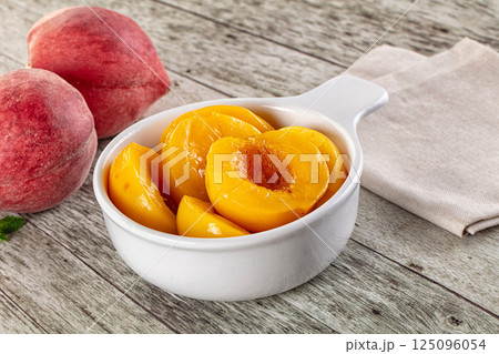 Sweet ripe yellow canned peaches Sweet ripe yellow canned peaches 125096054