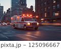 Emergency medical vehicle hurry on city street. Ambulance 125096667