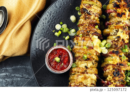 Tasty grilled meat skewers with potatoes. 125097172