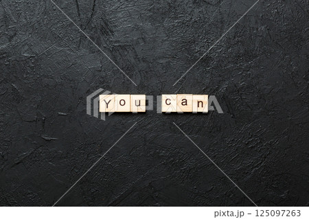 You can word written on wood block. You can text on cement table for your desing, Top view concept 125097263