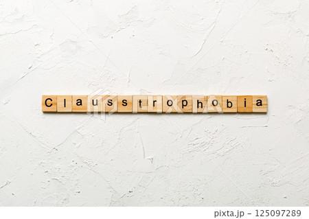 claustrophobia word written on wood block. claustrophobia text on table, concept claustrophobia word written on wood block. claustrophobia text on table, concept 125097289