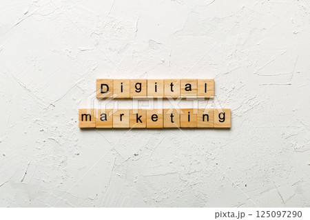 Digital Marketing word written on wood block. Digital Marketing text on cement table for your desing, concept Digital Marketing word written on wood block. Digital Marketing text on cement table for your desing, concept 125097290