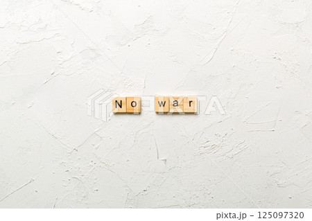 No war word written on wood block. No war text on table, concept No war word written on wood block. No war text on table, concept 125097320