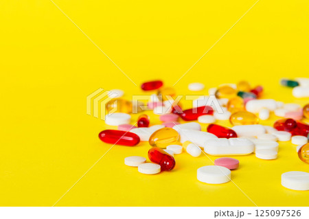 Many different colorful medication and pills perspective view. Set of many pills on colored background Many different colorful medication and pills perspective view. Set of many pills on colored background 125097526
