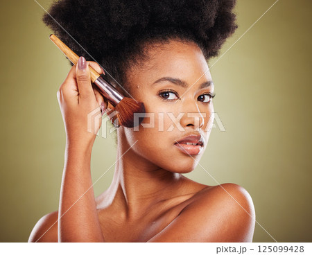 Makeup brush, black woman and beauty, cosmetics and cheek powder, foundation and product for glow, shine and face on studio background. Portrait of young african model, beauty and facial application 125099428