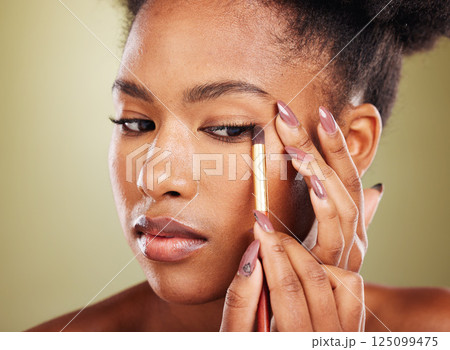 Beauty, makeup and black woman with eyeshadow brush for eyes on studio background. Glamour, cosmetics and skincare, portrait of beautiful African woman model with luxury cosmetic application on face. 125099475