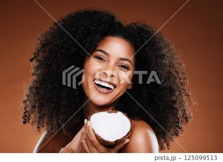Black woman, coconut and beauty cosmetics makeup or natural skincare wellness. Luxury skin nutrition, healthy facial glow and self care, afro and natural or organic hair care health in studio Black woman, coconut and beauty cosmetics makeup or natural skincare wellness. Luxury skin nutrition, healthy facial glow and self care, afro and natural or organic hair care health in studio 125099513