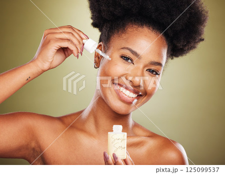 Portrait of black woman, beauty and skincare serum oil product for cosmetics healthcare, skin wellness and collagen treatment. Luxury makeup, facial spa treatment and happy African lady with a smile Portrait of black woman, beauty and skincare serum oil product for cosmetics healthcare, skin wellness and collagen treatment. Luxury makeup, facial spa treatment and happy African lady with a smile 125099537