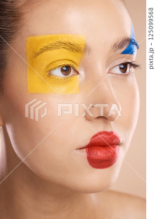 Creative, cosmetic and woman with clown makeup in a studio for halloween, circus or face paint. Creativity, beauty and model with facial cosmetics for self expression, fantasy or art design in studio Creative, cosmetic and woman with clown makeup in a studio for halloween, circus or face paint. Creativity, beauty and model with facial cosmetics for self expression, fantasy or art design in studio 125099568