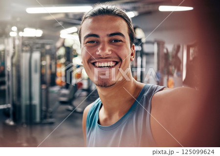Portrait of man, gym selfie and fitness influencer workout for motivation, sports cardio exercise and wellness training. Happy smile, athlete building muscle and healthy weight lifting for strength 125099624