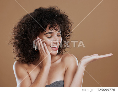 Woman, hand and beauty with advertising space for skincare, wellness and makeup marketing mockup in brown studio background. Model, happy and smile with hands gesture, cosmetics and health skin 125099776