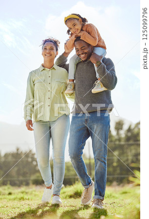 Black family, dad carry girl and outdoor for quality time, happy and smile together outdoor. Parents, mom and dad with daughter walking, bonding and being loving for happiness, on break and for fun. 125099796