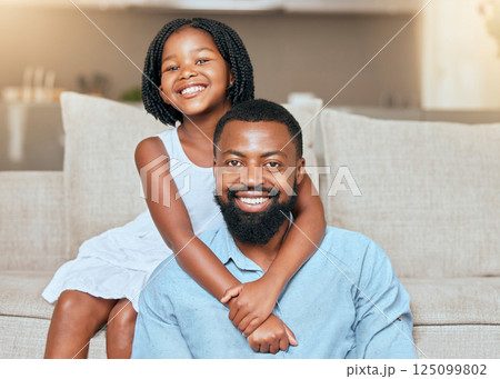 Love, black man father and girl hug, smile and in living room on sofa, with happiness and loving together. Portrait, African American dad and daughter embrace, happy and bonding in lounge on couch. 125099802